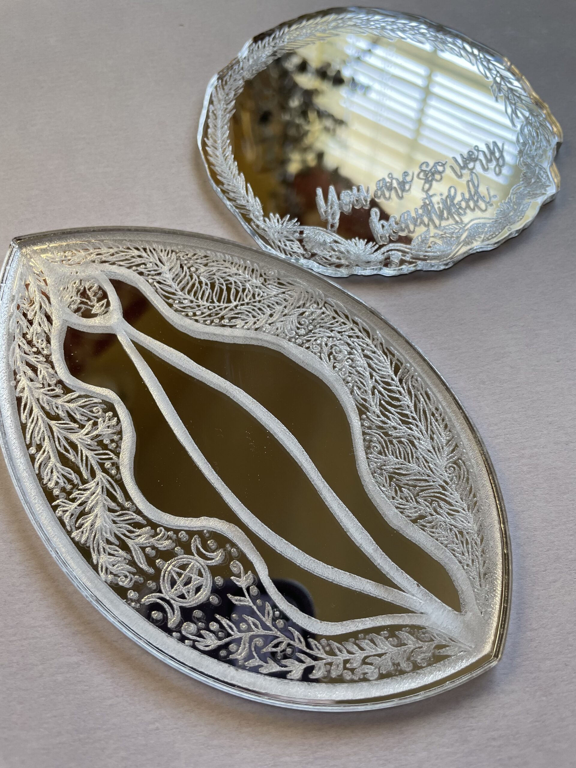 Laser cut and engraved mirrors